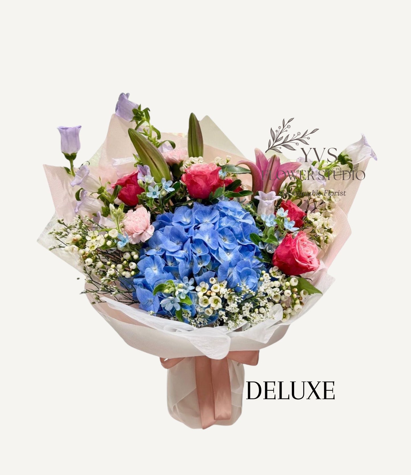 Bouquet of flowers with blue hydrangeas, lilac bell flowers and pink roses