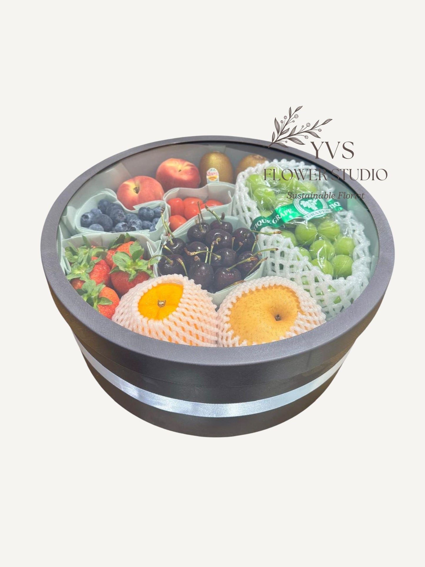 A variety of fruits in a decorative container with lid