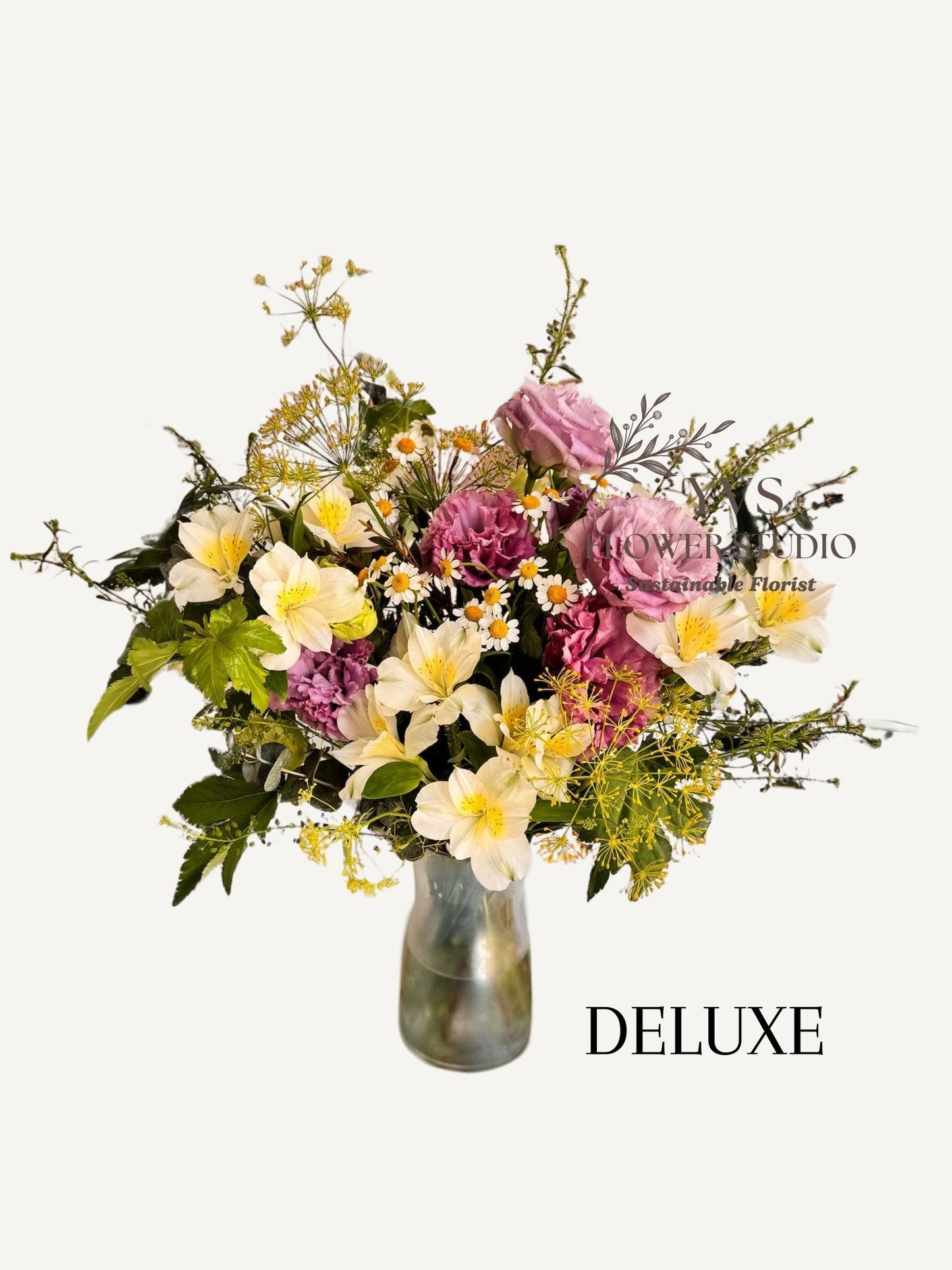 Colourful pastel flowers in a vase arrangement