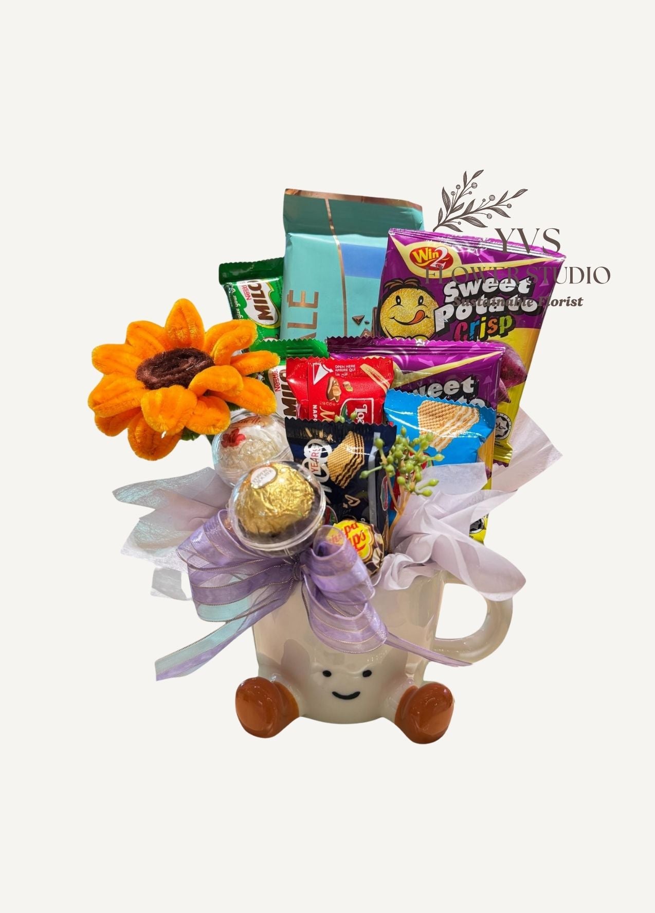 Smiley mug with chocolates, biscuits and candy