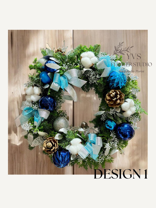 Fresh Christmas wreath with blue and silver decorations