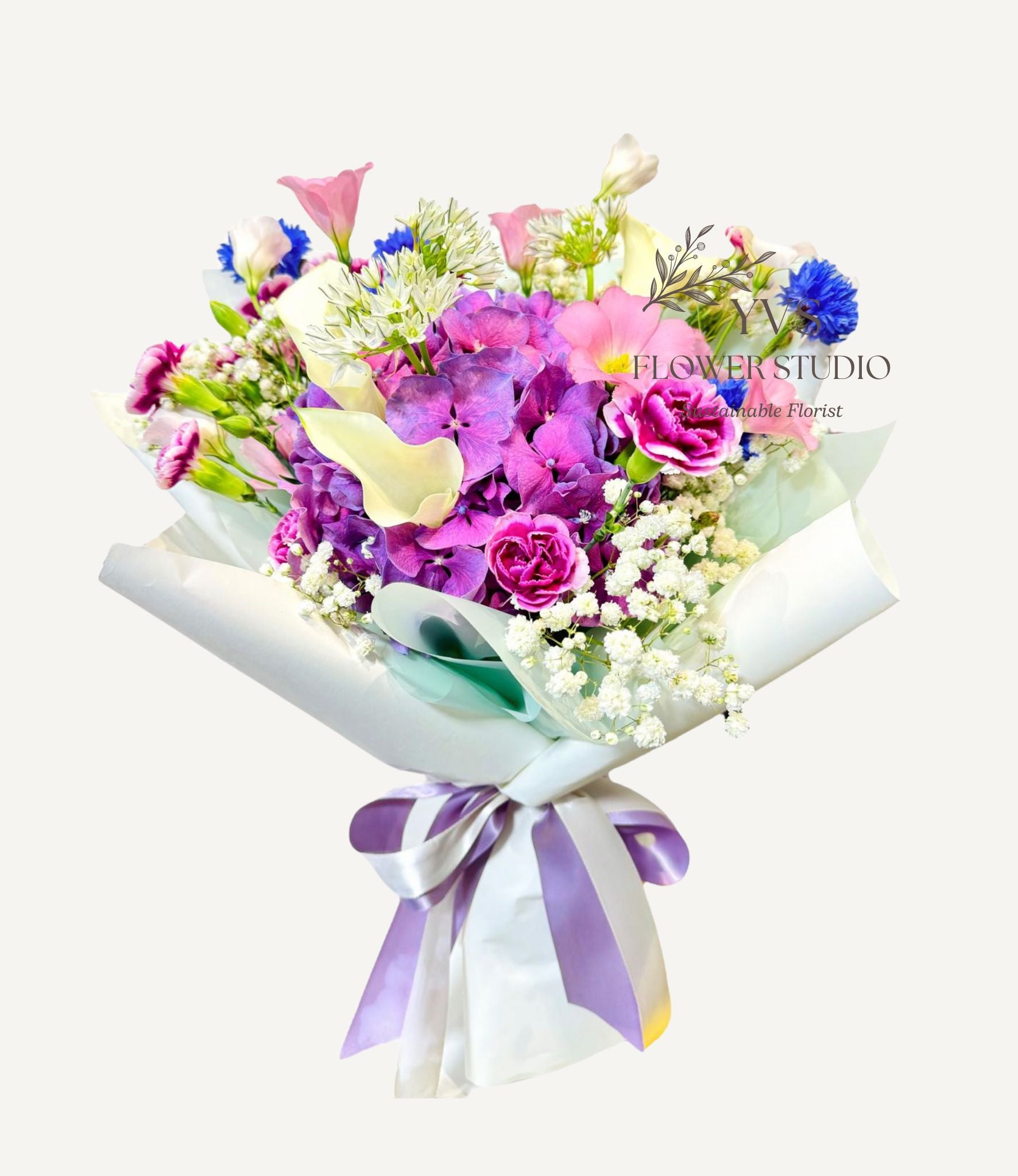 Fresh purple hydrangea bouquet with mixed flowers and foliage