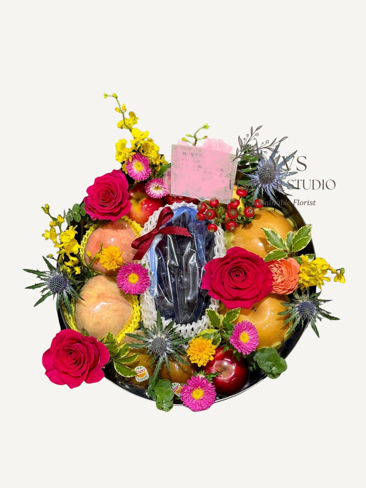 Top view of luxurious fruits hamper with vibrant flowers