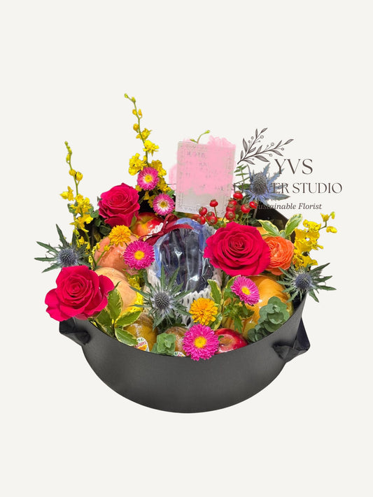 Luxurious fruits hamper with vibrant flowers