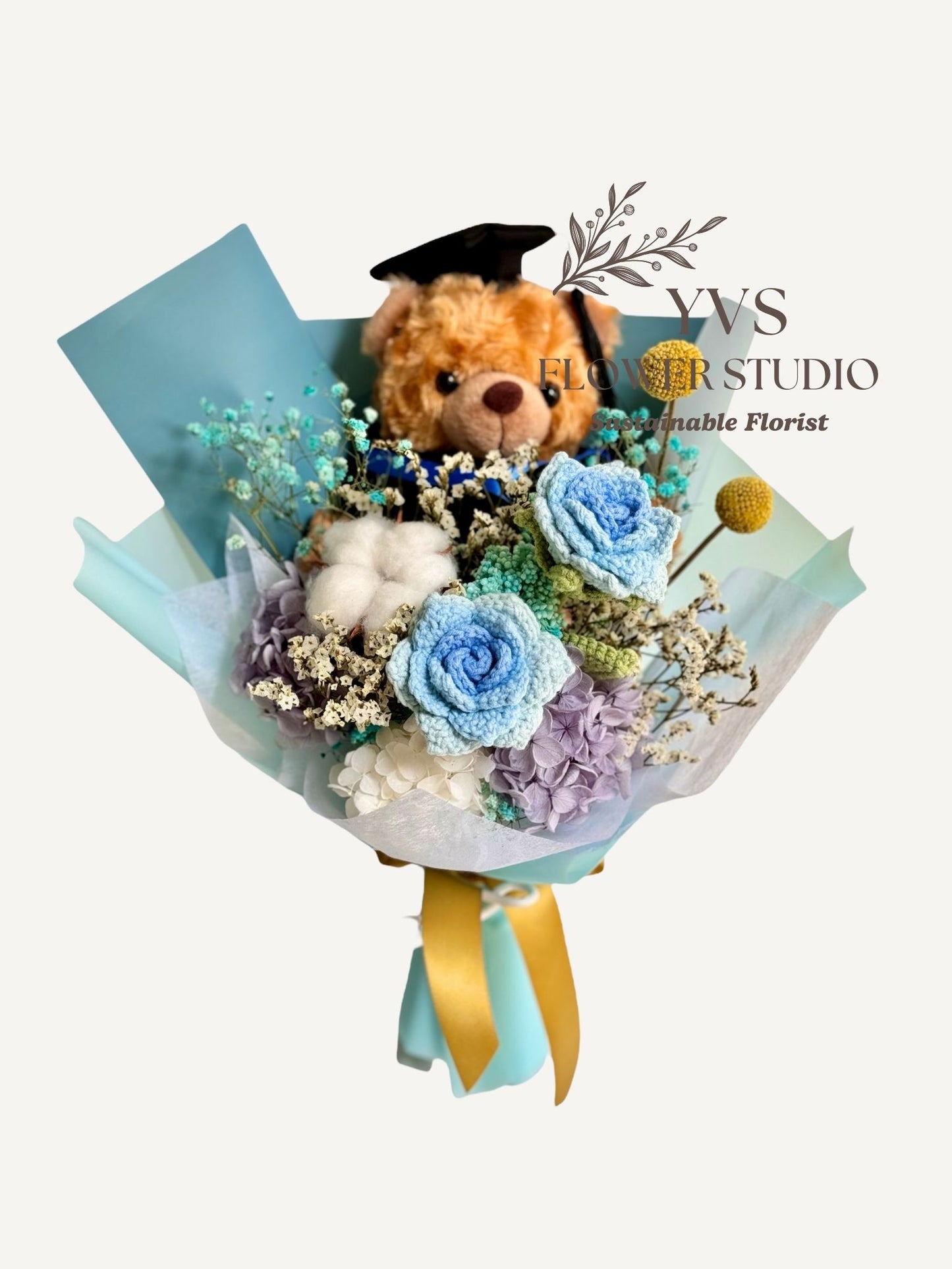 Graduation Bear with blue crochet and preserved flowers bouquet front view