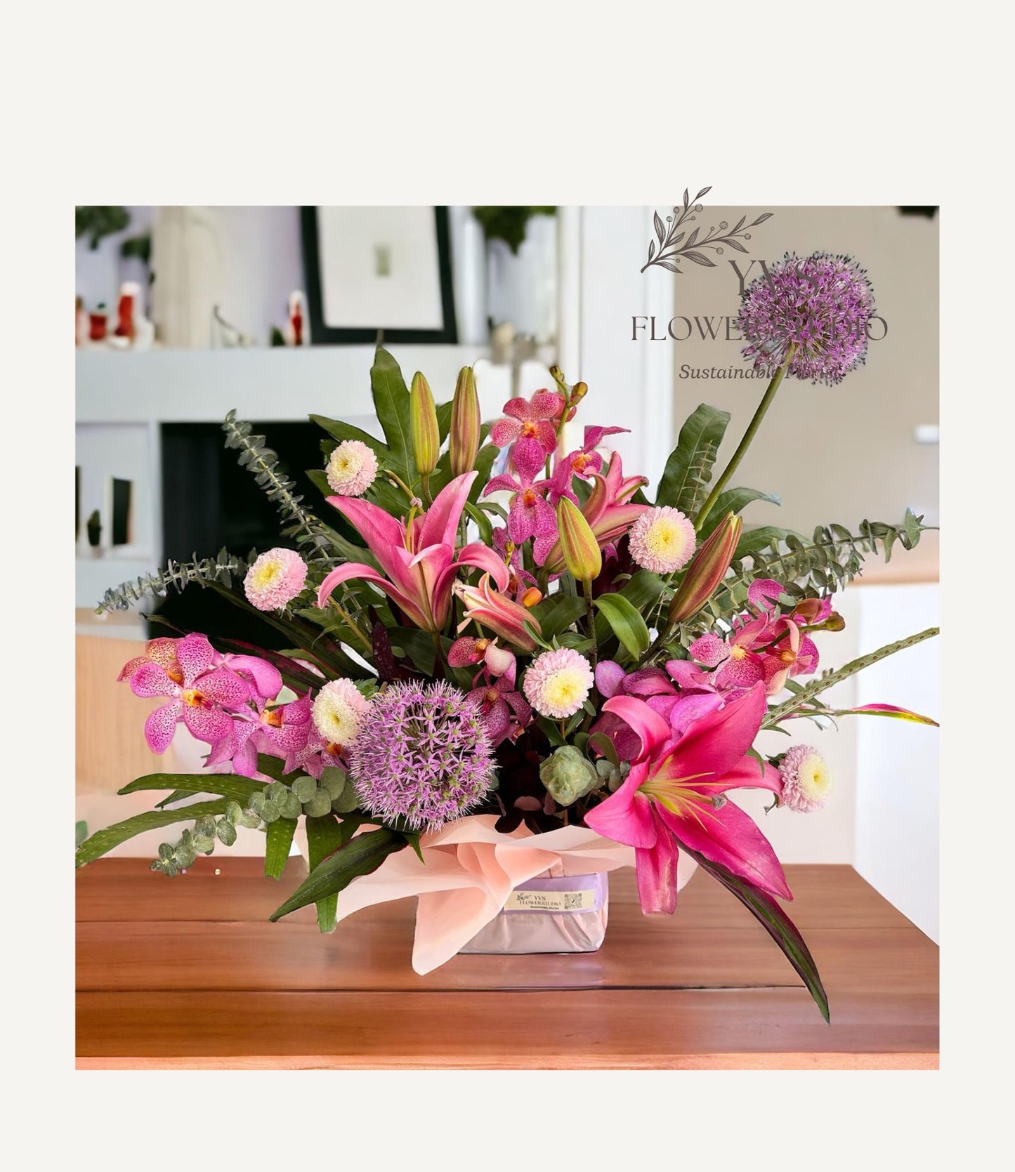 Congratulatory table flowers with lilies and orchids