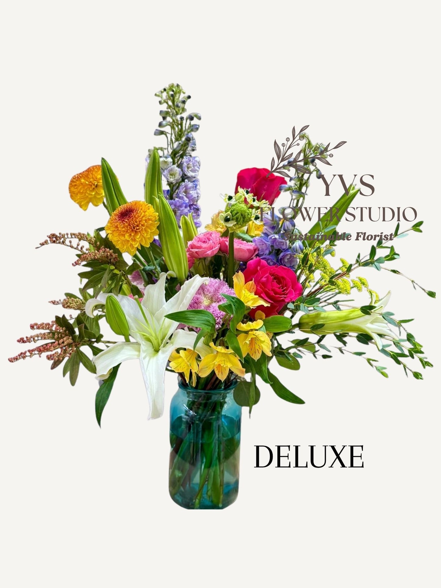 Colourful vibrant flower bouquet in a clear vase 
