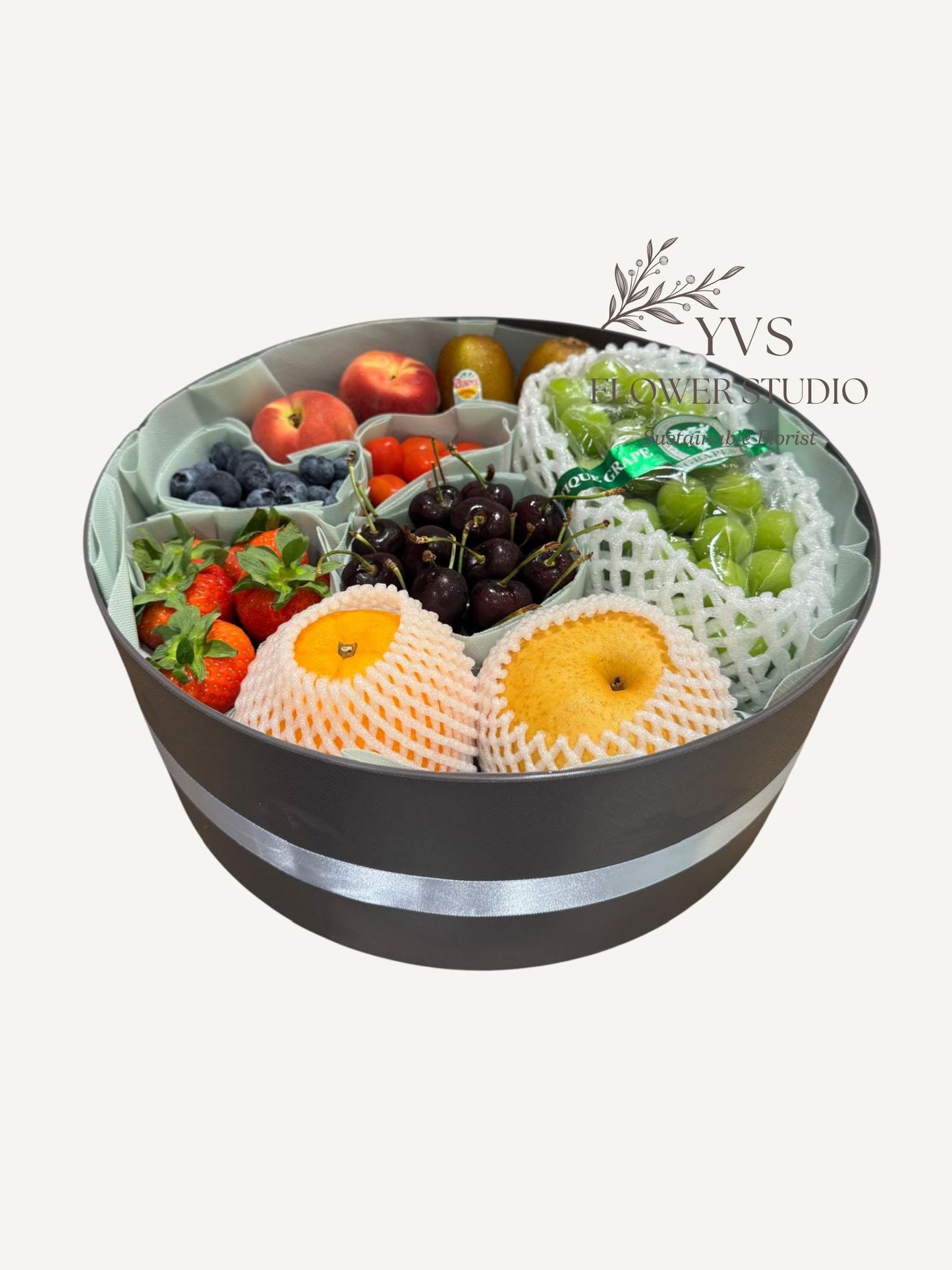 A variety of fruits in a decorative container 