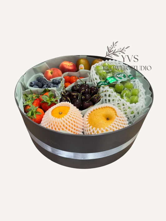 A variety of fruits in a decorative container 